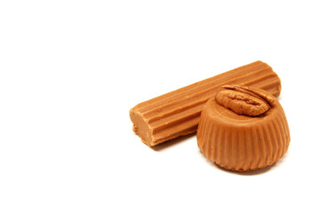 Mexican sweets, jamoncillo and macaroon on white background with space for text
