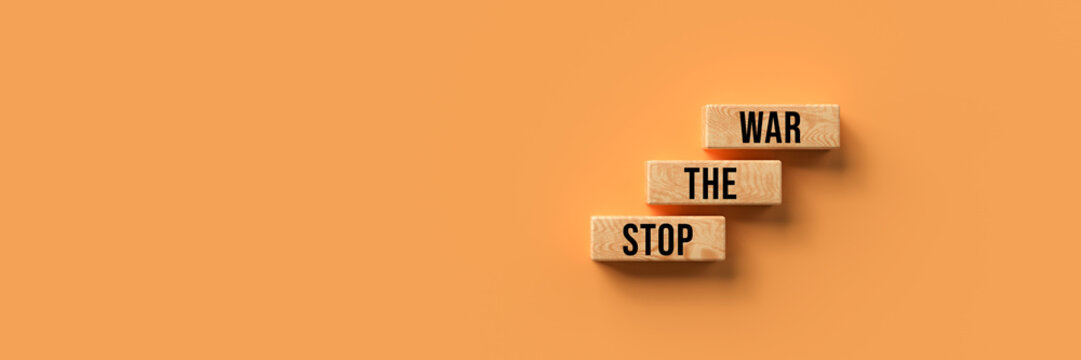 wooden blocks with the message STOP THE WAR on orange background