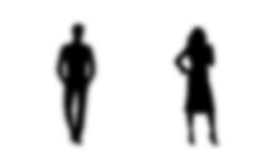 blurred silhouettes of a man and a woman, a couple of standing business people, black color isolated on a white background