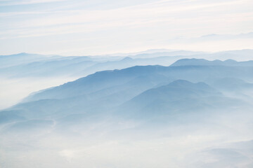 View of izmir's mountains in clouds from in airplane.
