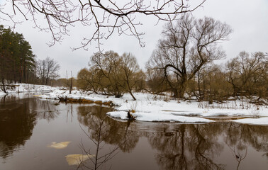 Spring landscape. River in early spring. Thaw. It's a nasty day