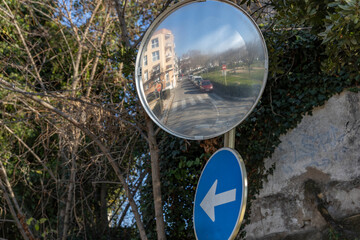 Reflections of the road from traffic convex mirror pole for car traffic safety
