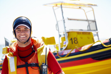 I love sea rescue. Cropped portrait of a handsome young male lifeguard preparing to go out to sea on a rescue mission.