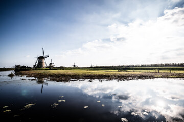 Horizontal picture of the famous Dutch windmills at Kinderdijk, a UNESCO world heritage site. On the photo are five of the 19 windmills at Kinderdijk, South Holland, the Netherlands, which are built