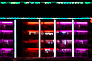 Abstract bokeh blurred background defocused lighting night showcases in nightclub, bar, pub, shop for design. Multicolored circles, spots of light. Lens Blur effect of a soft out-of-focus background