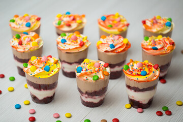 Trifles in plastic glasses.