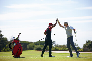Good shot buddy. Shot of two happy men playing a game of golf. - Powered by Adobe