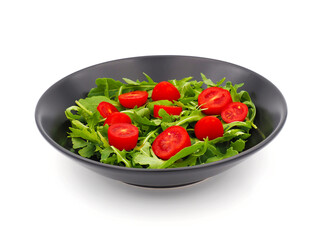 Green Arugula salad with red tomatoes isolated on white background