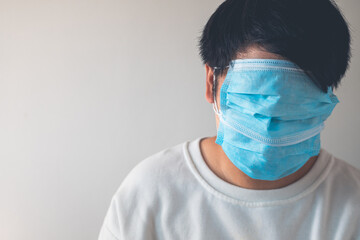 Medical masks wearing in correct way. But he uses them redundantly. Protection global pandemic of...