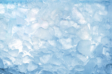Abstract ice texture. Icy chunks on the surface. Top view close up. Fragments of crystals of...
