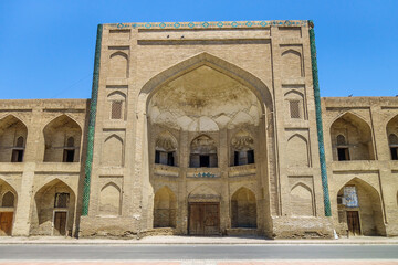 Fototapeta na wymiar Mullo Tursunjon Madrasah, Bukhara, Uzbekistan. Structure was built in the XVI century in the traditions of Bukhara architecture. UNESCO object