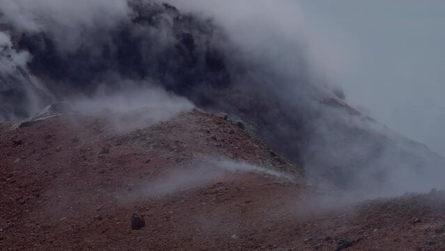Caldera of Avachinsky stratovolcano, also known as Avacha Volcano. Swinging steam from hot geysers. Kamchatka Peninsula, Russia.