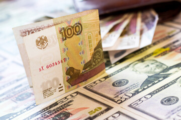 One hundred rubles bill and dollars