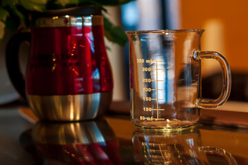 Glass measuring cup on a counter.