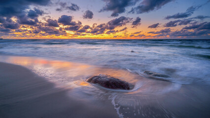 colorful sunset on the rocky seashore