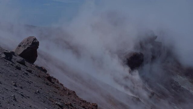 Caldera of Avachinsky stratovolcano, also known as Avacha Volcano. Swinging steam from hot geysers. Kamchatka Peninsula, Russia.