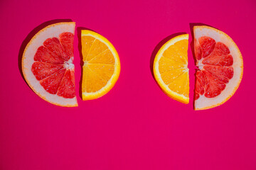 fruit citrus slices of grapefruit and orange on the crimson background 