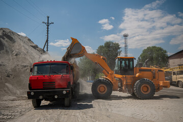 Loading gravel into a truck.