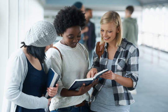 I remembered this section.... A group of college students looking at a book together.