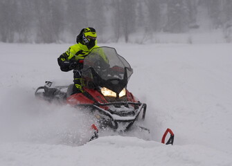 Artybash. Russia. February 26, 2022 A participant of the winter festival Snow Rally on a snowmobile...