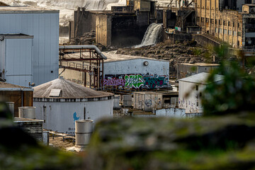 Buildings hugging the Willamette Falls at the Oregon City Blue Heron Papermill. 