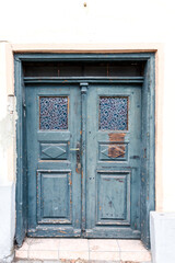 Old weathered blue wooden double door