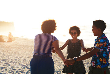 Friends make the world a better place. Cropped shot of an attractive young trio of women enjoying a day out together on the beach during the day.