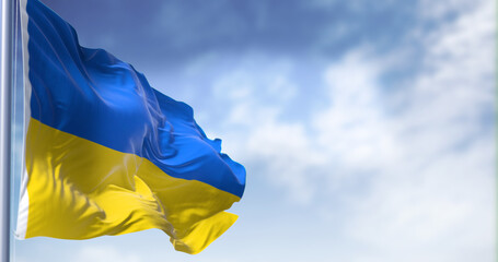 Detail of the national flag of Ukraine waving in the wind on a clear day. Democracy and politics. Patriotism. Selective focus.