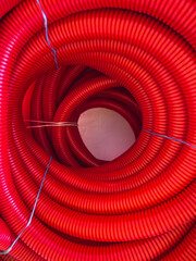 hydraulic conduit, pipe cover rolled up in a circle