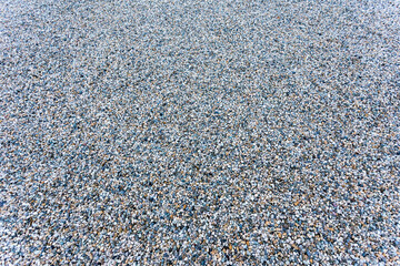 Background texture of fine grained grey gravel