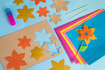 Handmade flowers from multi-colored paper for mother's day, women's day on March 8, birthday. Step...