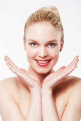 Ive found the secret to perfect skin. Portrait of a smiling blonde caucasian woman with her hands framing her face.