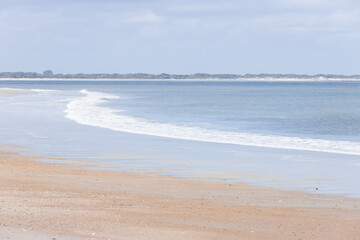 Beach, ocean, waves, blue sky with clouds 