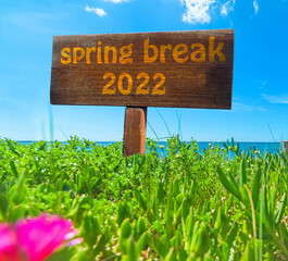 Spring break 2022 written on a wooden sign