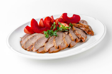 Juicy turkey pastrami with baked apple in berry sauce with strawberries on a white plate. Banquet festive dishes. Gourmet restaurant menu. White background.