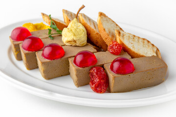 Chicken turkey pate with berry jelly and toast on a white plate. Banquet festive dishes. Gourmet restaurant menu. White background.