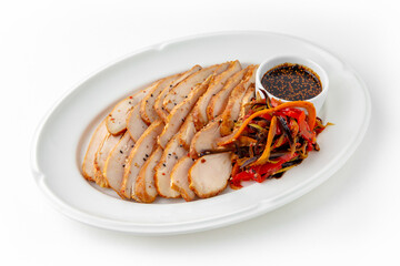 Chicken pastrami with stewed vegetables and sauce on a white plate. Banquet festive dishes. Gourmet restaurant menu. White background.