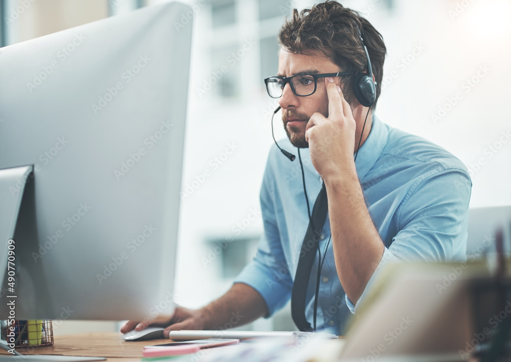 Aufkleber trust him to find the answer. shot of a young man working in a call center.