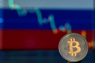 Bitcoin coin on the background of the Russian flag with a decline chart