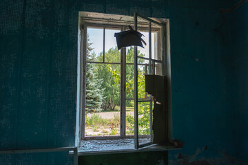 Ukraine, room after the explosion in the building. Broken glass at the window. War.