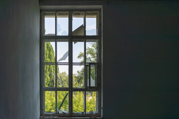 Ukraine, room after the explosion in the building. Broken glass at the window. War.