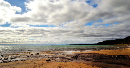 clouds over the beach in Lake Michigan