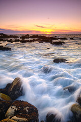 Sunset on the rocky shore of Pacific Grove overlooking Monterey Bay.