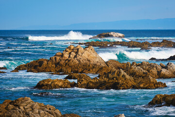 Waves crashing on the rocky coast of Pacific Grove, CA on Monterey Bay. 