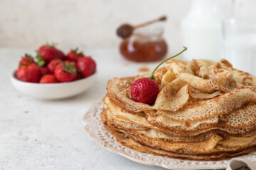 Homemade crepes on a white plate