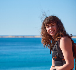 Fototapeta na wymiar A portrait of a young Caucasian girl on the beach in Spain