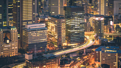 Fototapeta na wymiar Osaka, Japan cityscape in the Umeda building rooftop night view