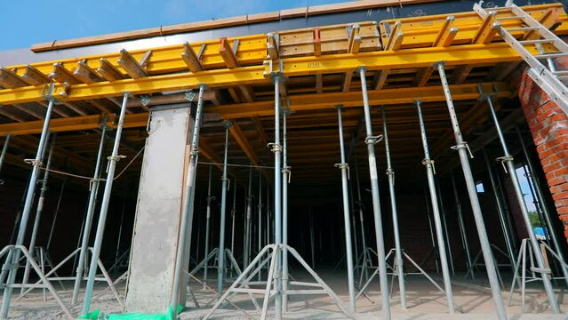 The process of creating a floor. Formwork flooring. Exterior of a building under construction. Formwork rack