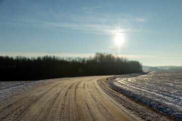 dangerous road in winter after snowfall,