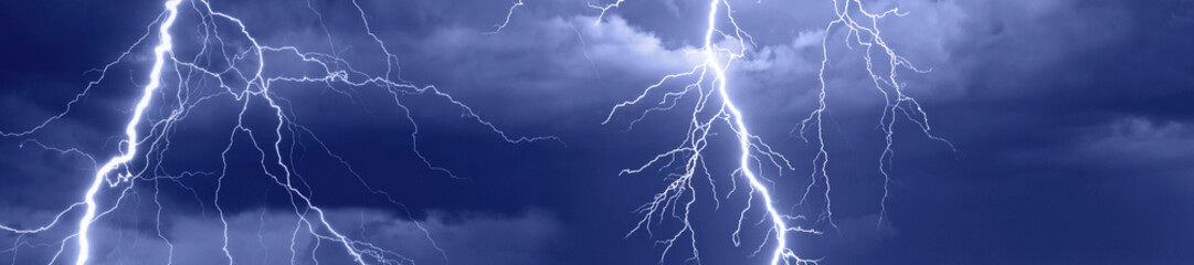 Lightnings, thunder and rain during summer storm.